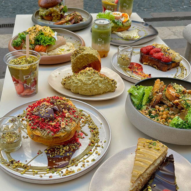 Pistachio-driven brunch table at Pink Pistachio Brunch in Budapest, featuring sweet and savory dishes, desserts and signature drinks