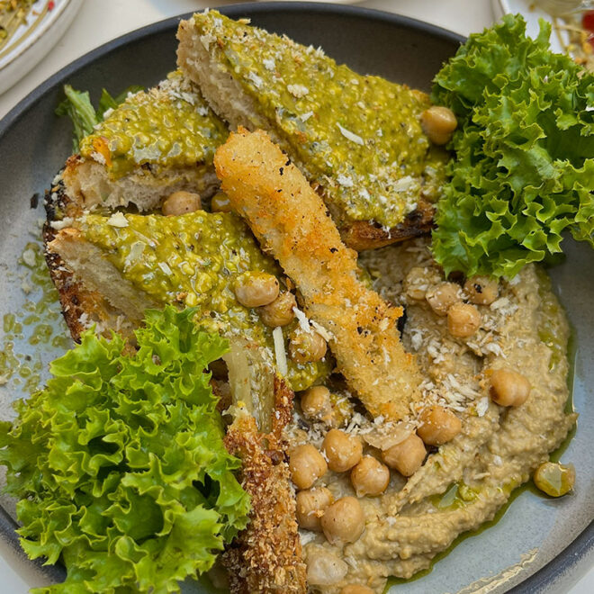 Pistachio hummus at Pink Pistachio Brunch served with sourdough bread and pistachio crumble