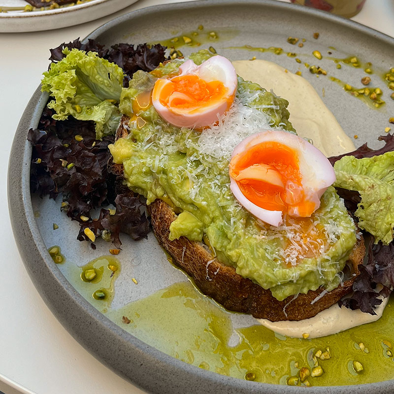 Brunch Budapest avocado pistachio toast at Pink Pistachio Brunch with pistachio cream and marinated egg
