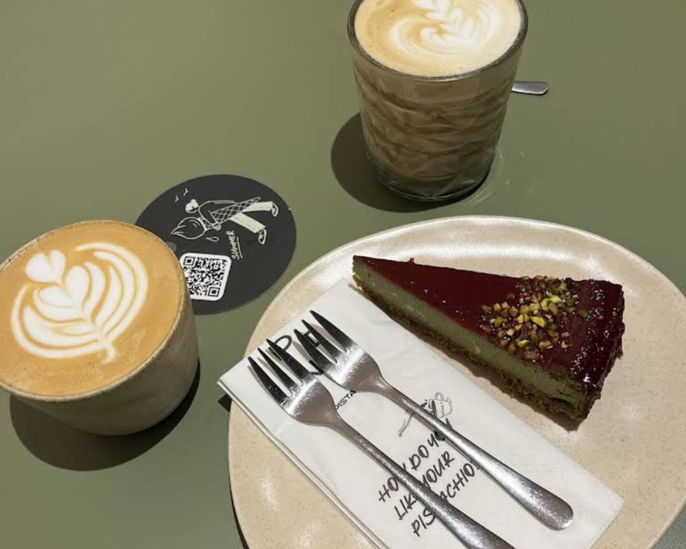 Pistachio cake served with specialty coffee at Pink Pistachio Brunch in Budapest